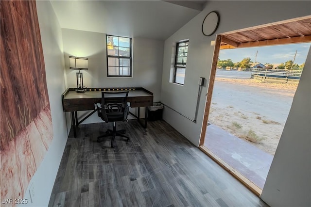 office space with vaulted ceiling and dark hardwood / wood-style flooring