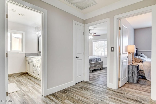 hall with light wood-type flooring