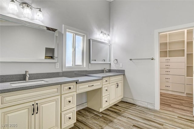 bathroom with wood-type flooring and vanity