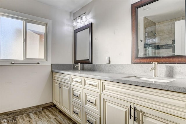 bathroom featuring vanity and a shower with door