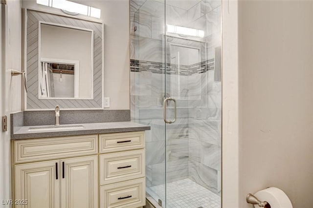 bathroom with vanity and a shower with door