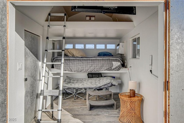 bedroom with hardwood / wood-style floors