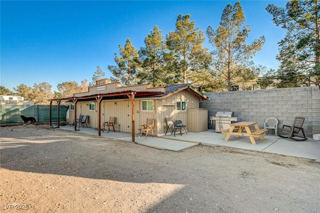 rear view of house with a patio