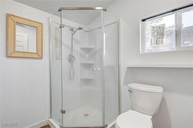 bathroom with walk in shower and toilet