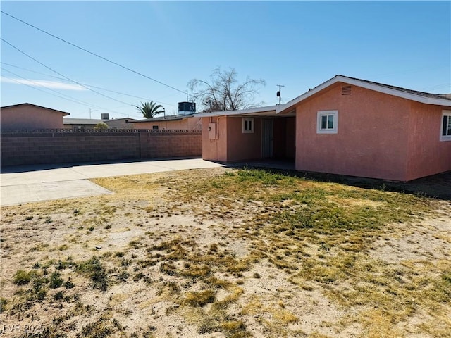 back of house with a patio area