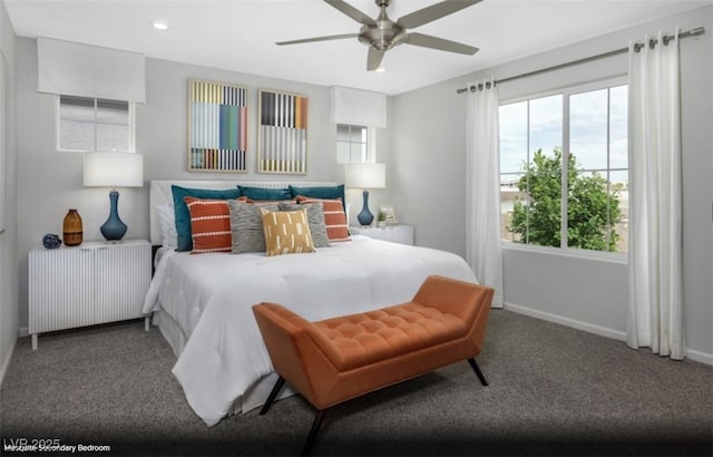 bedroom featuring carpet floors, radiator heating unit, and ceiling fan