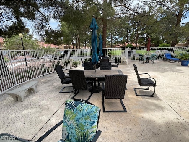 view of patio / terrace with outdoor dining space and fence