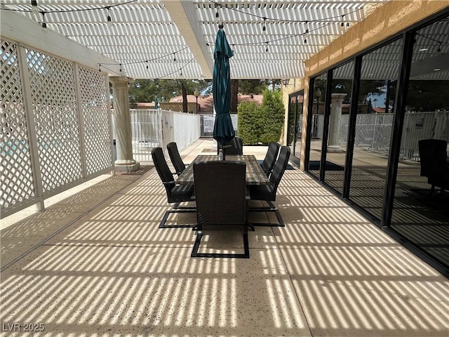 exterior space featuring outdoor dining space, fence, and a pergola