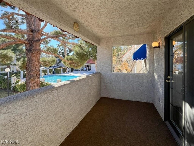 view of patio with a balcony