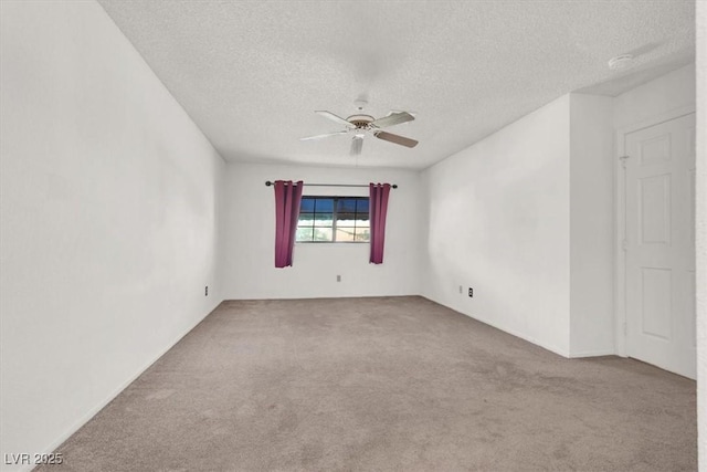 unfurnished room with carpet, a textured ceiling, and ceiling fan