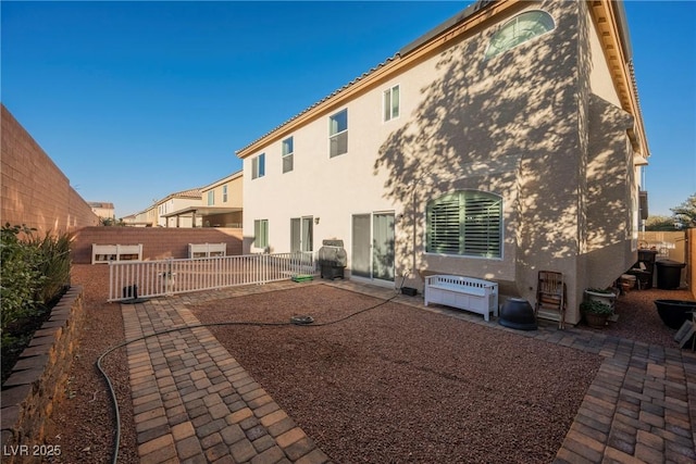 back of house featuring a patio area