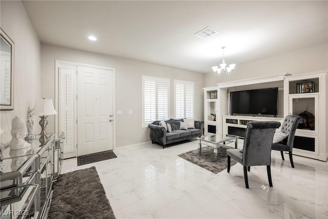 living room with an inviting chandelier