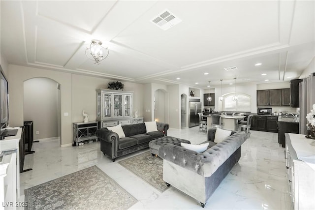 living room with a notable chandelier