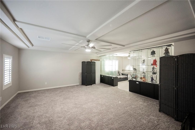 interior space with carpet floors and ceiling fan