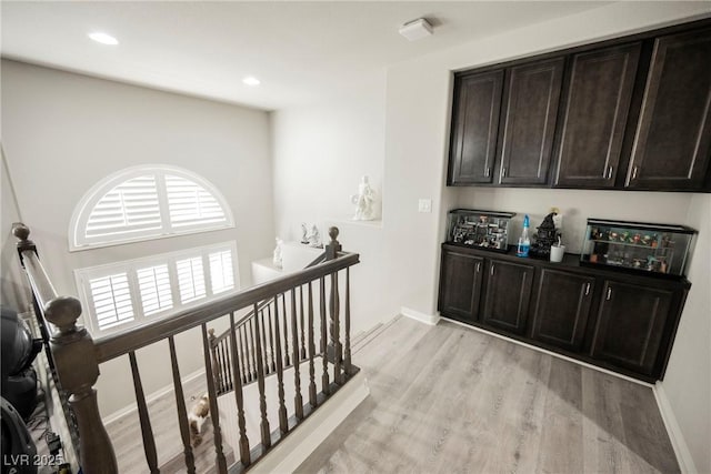 hall with light hardwood / wood-style floors