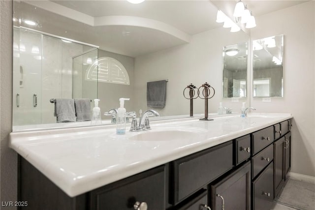 bathroom featuring vanity, tile patterned flooring, and a shower with door