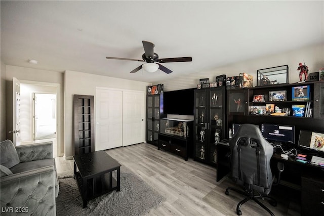 office featuring wood-type flooring and ceiling fan