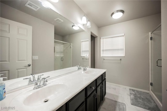 bathroom featuring an enclosed shower and vanity