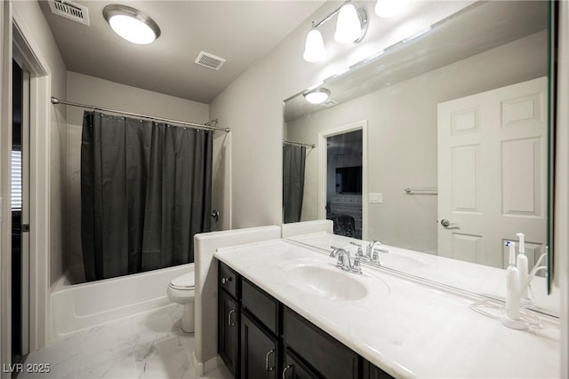 full bathroom with shower / bath combo, vanity, and toilet