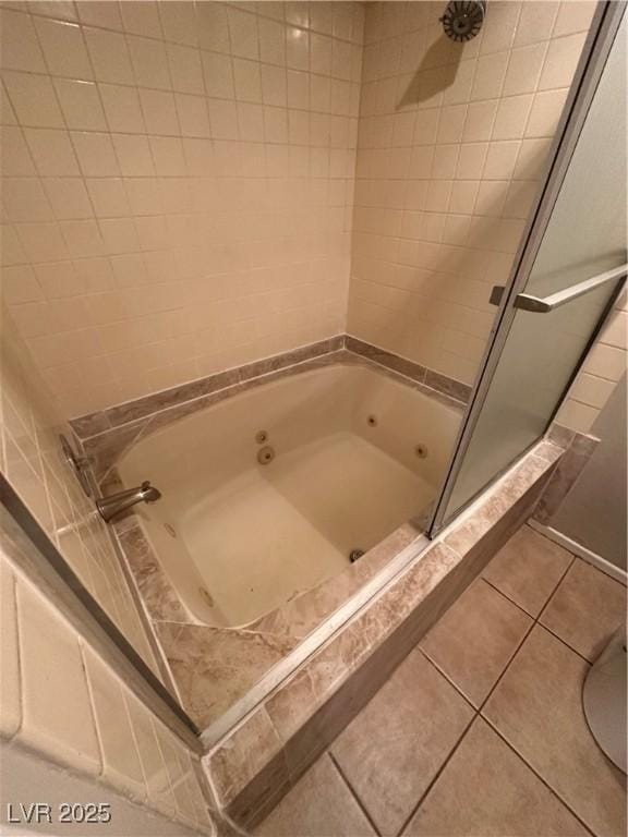 bathroom with tile patterned floors and shower with separate bathtub