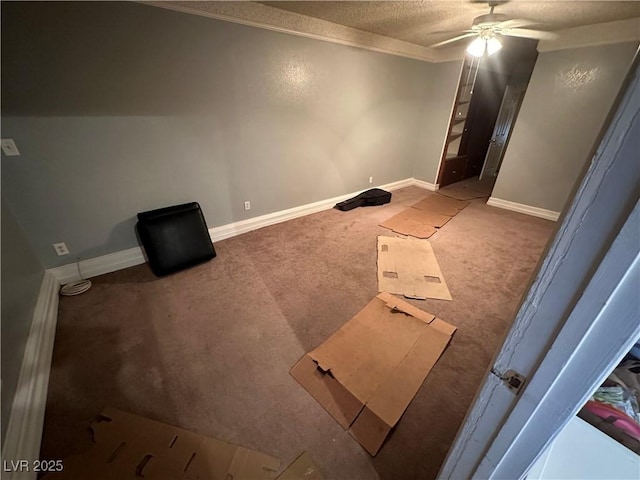 spare room with a textured ceiling, ceiling fan, and carpet flooring