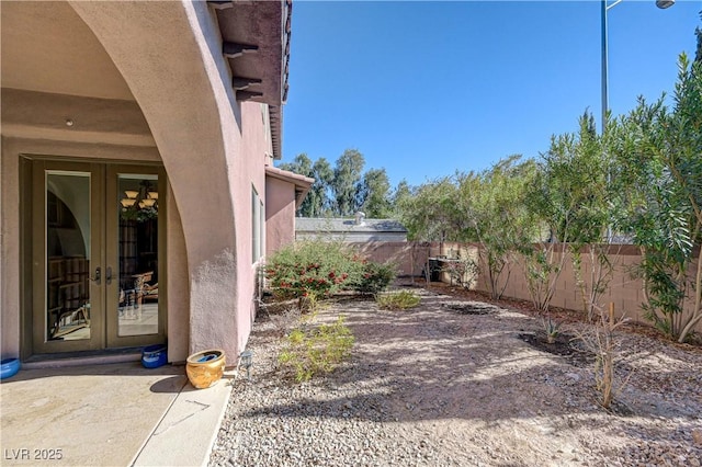 view of yard featuring french doors