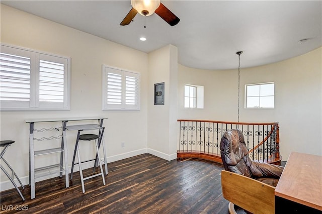 home office featuring dark hardwood / wood-style flooring and ceiling fan