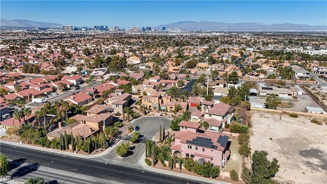 birds eye view of property featuring a mountain view