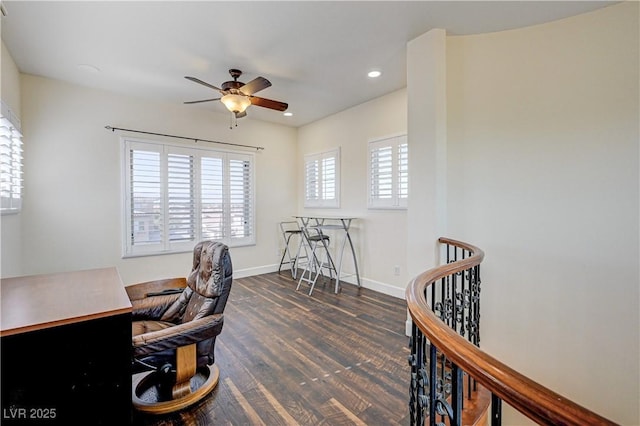 office space featuring dark hardwood / wood-style floors and ceiling fan