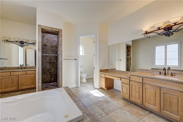 full bathroom with vanity, toilet, tile patterned flooring, and plus walk in shower