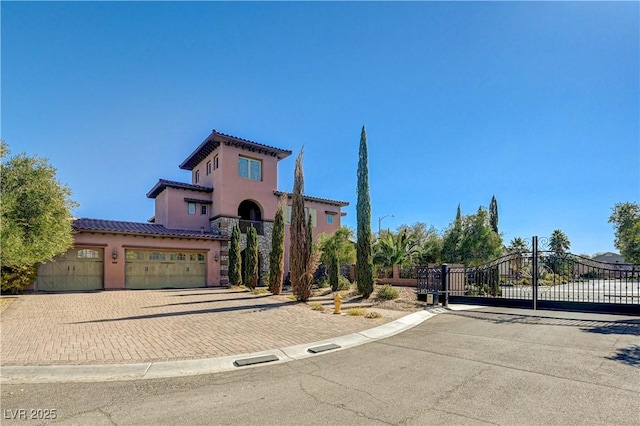 mediterranean / spanish-style home with a garage