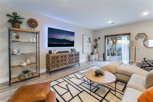 living room with light hardwood / wood-style floors