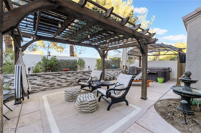 view of patio / terrace featuring a hot tub and a pergola