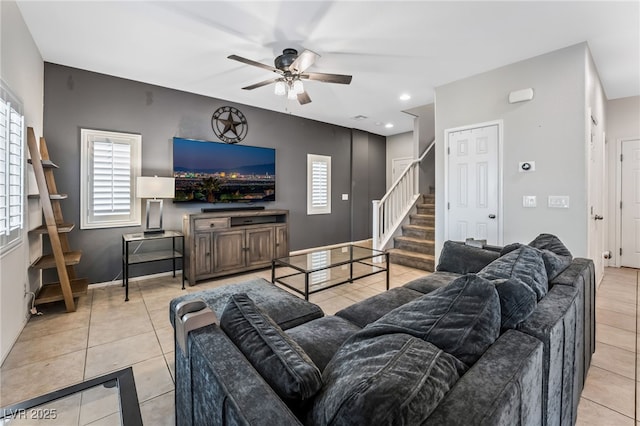 tiled living room featuring ceiling fan