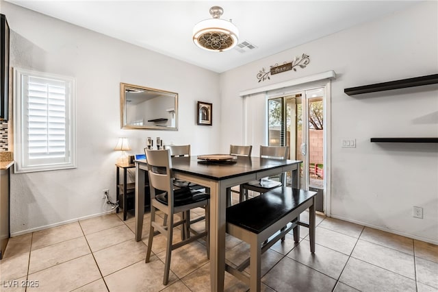 dining room featuring light tile patterned flooring