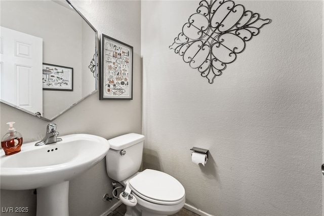 bathroom with sink and toilet