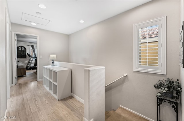 hallway with light hardwood / wood-style flooring