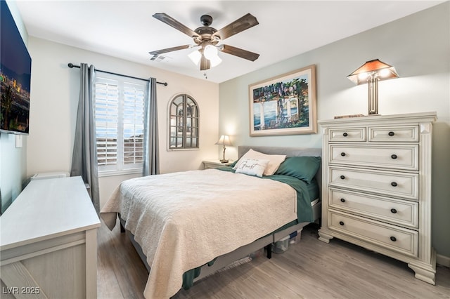 bedroom featuring hardwood / wood-style floors and ceiling fan