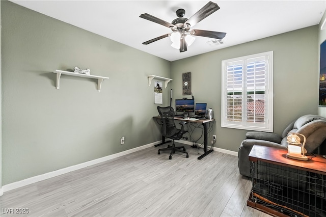 office with ceiling fan and light hardwood / wood-style floors