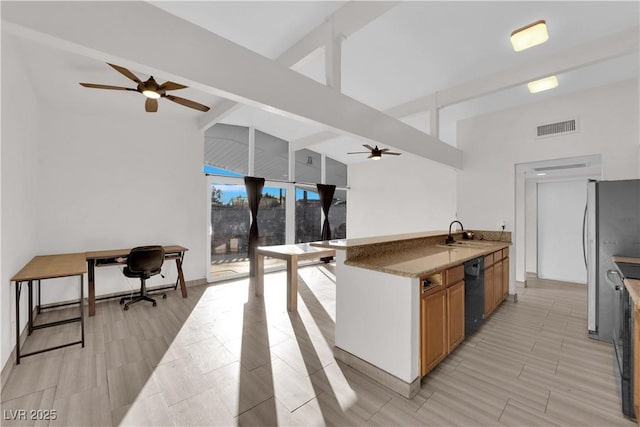 kitchen featuring sink, vaulted ceiling with beams, stainless steel refrigerator, black dishwasher, and ceiling fan