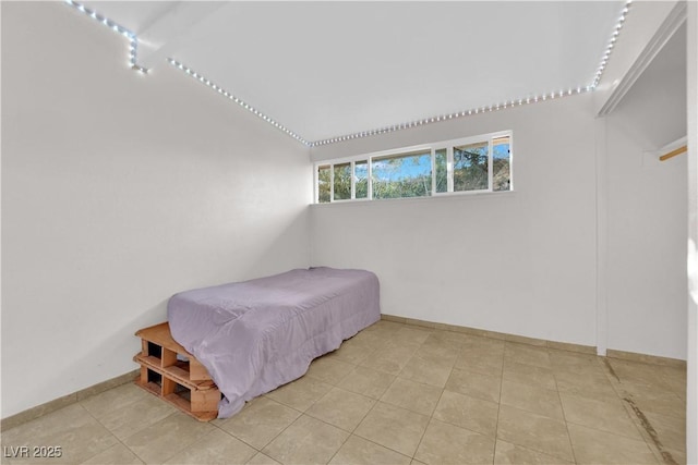 bedroom featuring light tile patterned floors