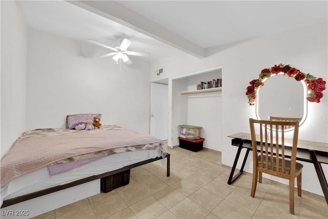 tiled bedroom featuring ceiling fan and beam ceiling