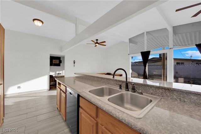 kitchen featuring sink, beamed ceiling, black dishwasher, and ceiling fan