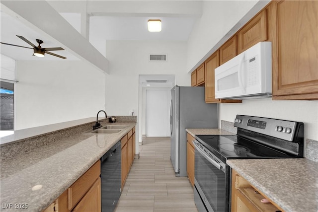 kitchen with ceiling fan, dishwasher, sink, and electric range