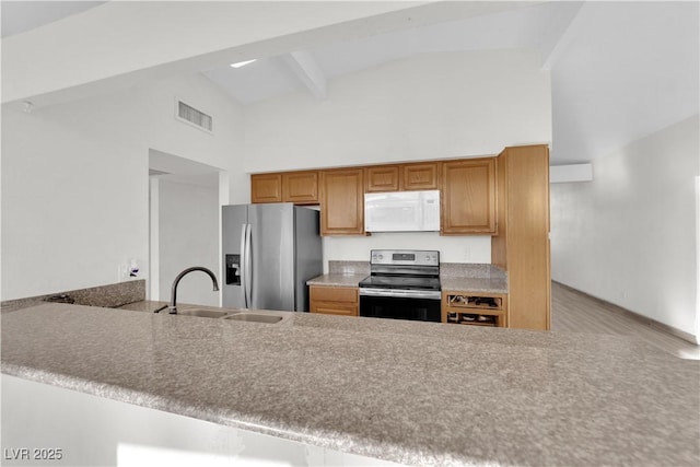 kitchen with high vaulted ceiling, beamed ceiling, sink, kitchen peninsula, and stainless steel appliances