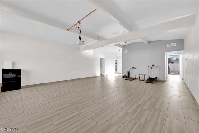 interior space featuring vaulted ceiling with beams