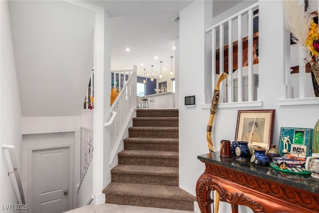 staircase with tile patterned flooring