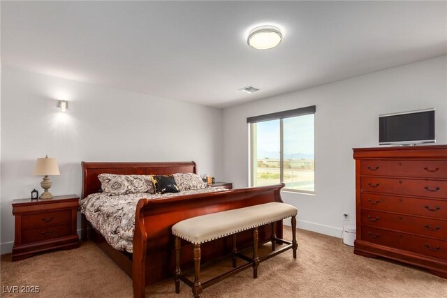 bedroom with light colored carpet