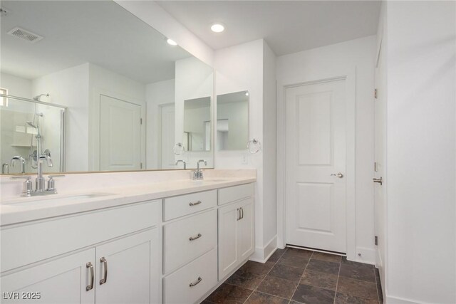 bathroom featuring vanity and walk in shower