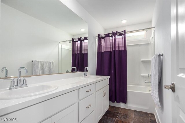 bathroom featuring vanity and shower / bath combo with shower curtain